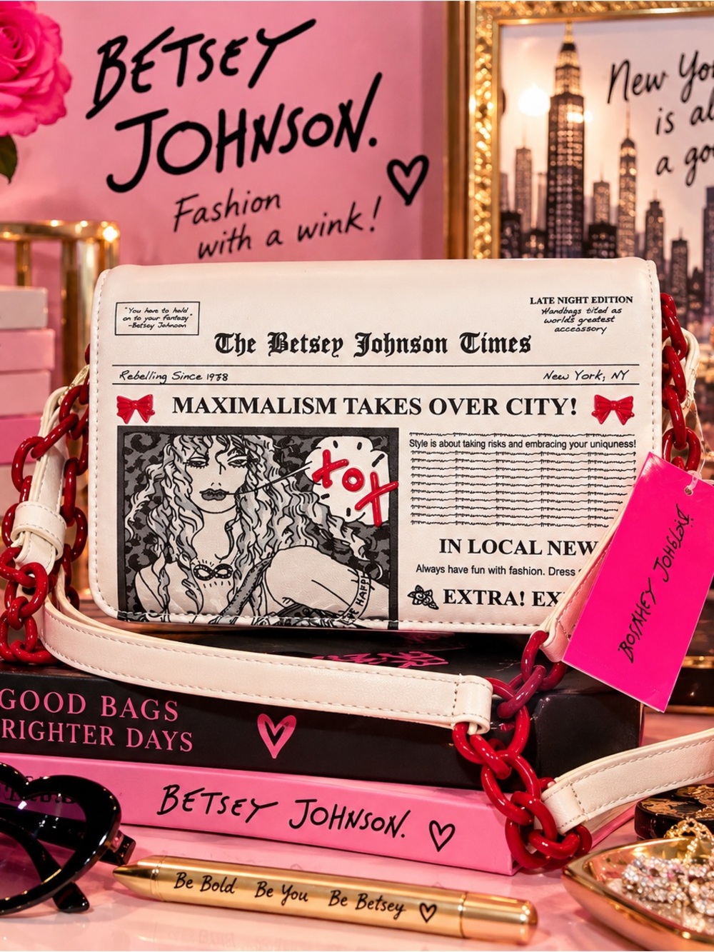 Betsey Johnson White Newspaper-Print Crossbody Bag with Pink Tag and Red Chain